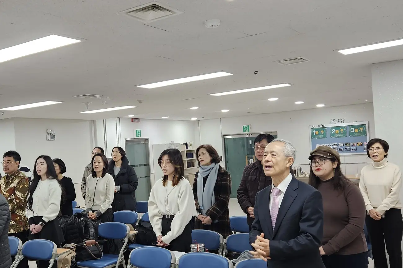 The congregation standing in song