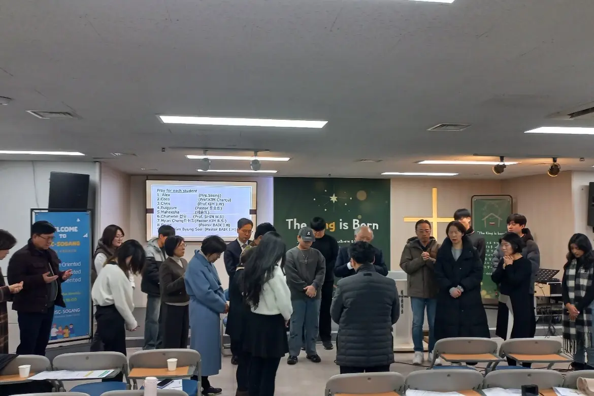 Praying together at the last Sunday service of the year