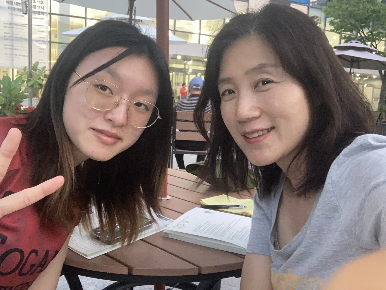 Reading together over coffee at an outdoor cafe