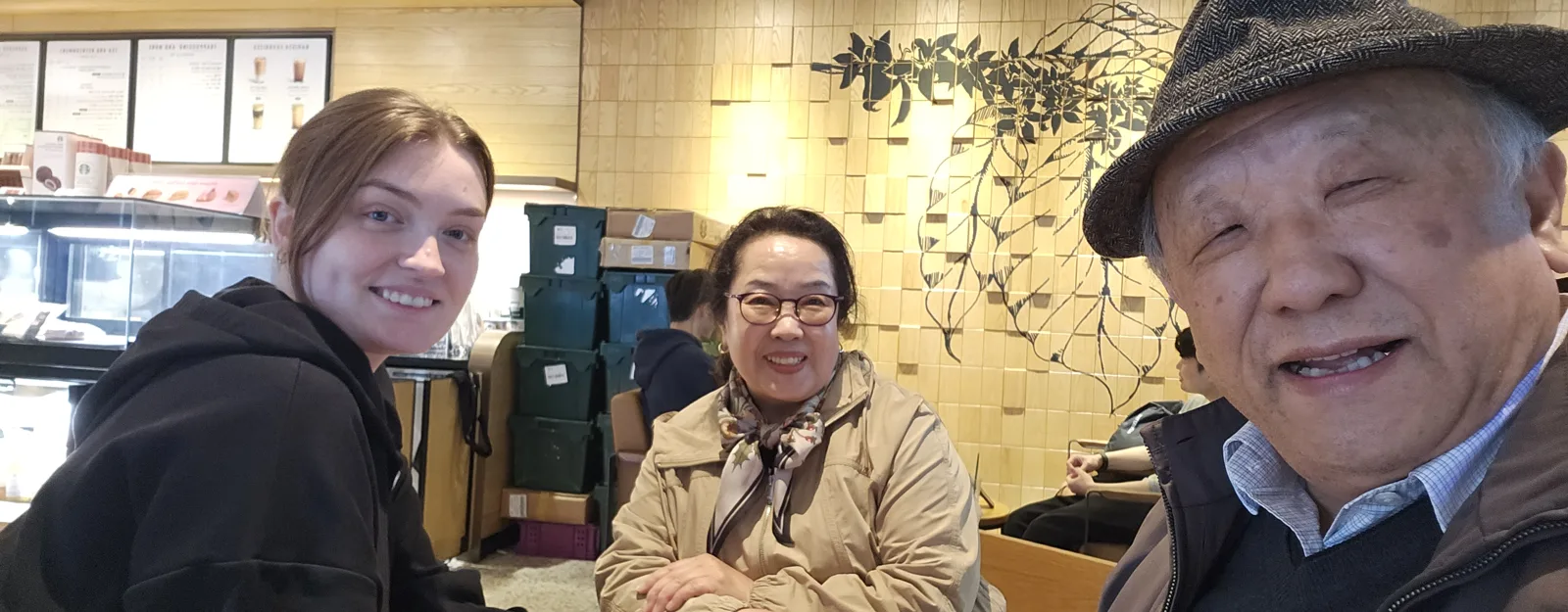 Teacher and student selfie at a cafe